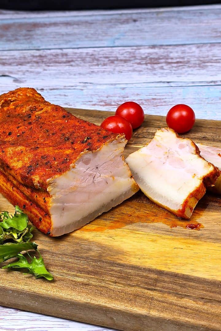 Boiled Pork Belly Appetizer Sliced and Served on the Chopping Board