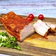 Boiled Pork Belly Appetizer Sliced and Served on the Chopping Board