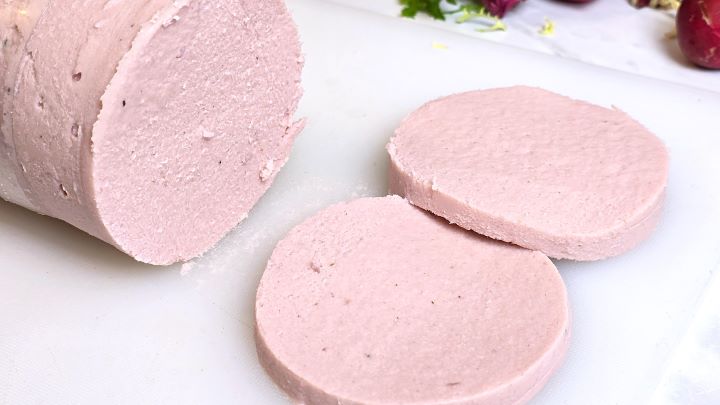 Two Homemade Turkey Bologna Slices and Radish on the Chopping Board