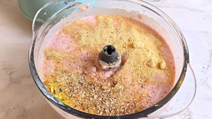 Spices Over Meat Paste in the Electric Chopper