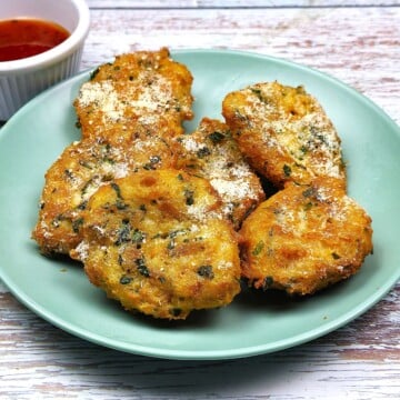 Six Italian Bread Balls Served on Green Plate-timeaskitchen.com