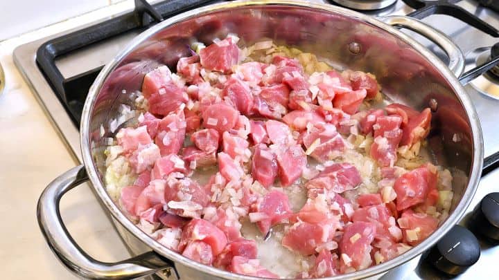 Sauteeing Pork Dice and Onions in the Pan