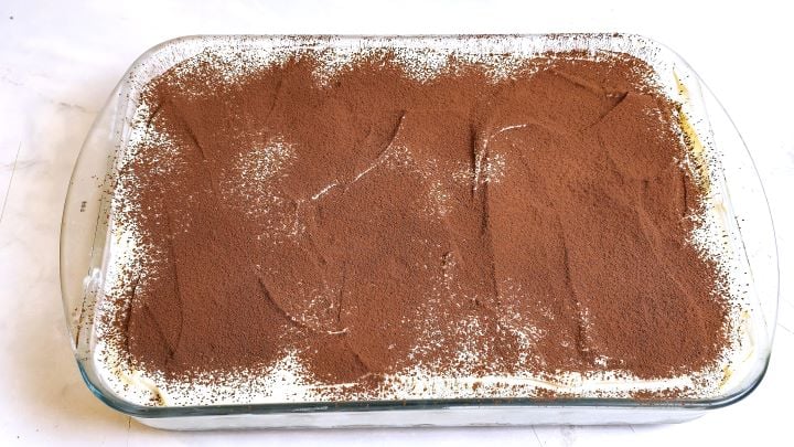 Cocoa Powder Over the Tiramisu in the Glass Tray