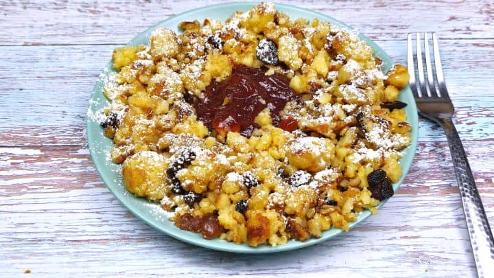 Hungarian Csaszarmorzsa (Shredded Pancake) Served on Blue Plate With Raspberry Jam