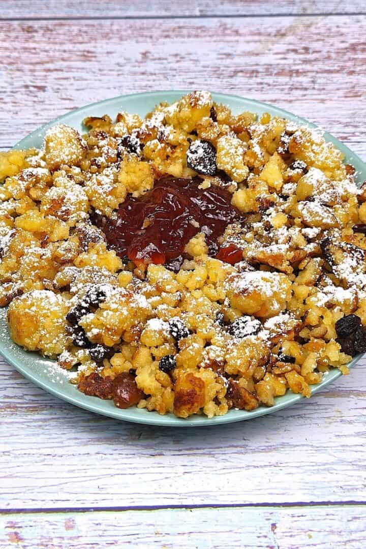 Hungarian Csaszarmorzsa (Shredded Pancake) Served on Plate With Raspberry Jam