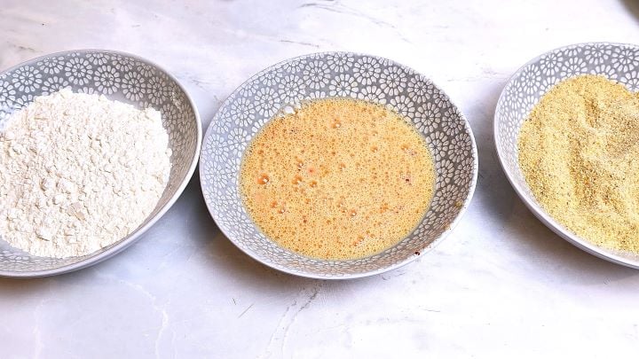 Three Plates With Flour, Beaten Eggs, and Breadcrumbs