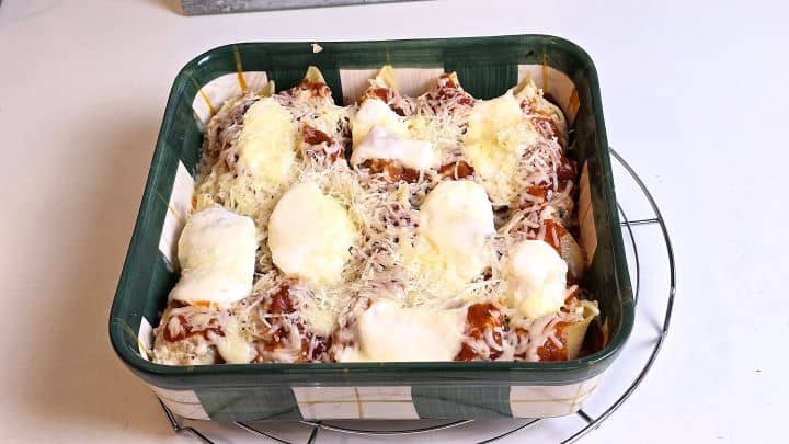 Stuffed pasta shells after 10 minutes of covered baking with aluminum foil.